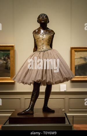 The Little Fourteen-Year-Old Dancer is a bronze sculpture by Edgar Degas on display at the Metropolitan Museum of Art in New York City. Stock Photo