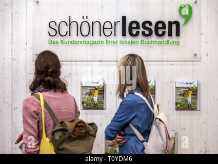Leipzig, Germany. 22nd Mar, 2019. Two visitors of the Leipzig Book Fair are standing at the stand of the customer magazine of the book trade. The Book Fair will continue until 24.03.2019. Credit: Jan Woitas/dpa-Zentralbild/dpa/Alamy Live News Stock Photo