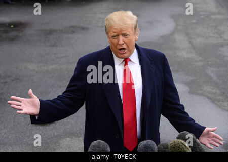 Washington, District of Columbia, USA. 22nd Mar, 2019. United States President DONALD J. TRUMP takes questions from the media as he departs the White House in Washington, DC for a weekend in Mar-a-Lago, Florida. Credit: Ron Sachs/CNP/ZUMA Wire/Alamy Live News Stock Photo