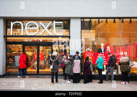 Queues of shoppers in Preston, Lancashire, UK. 23rd March, 2019. Next mid-season spring sale. The Next sale is a retail legend, with hundreds of shoppers up and down the country flocking to stores, and on-line to grab some clearance bargains. Stock Photo