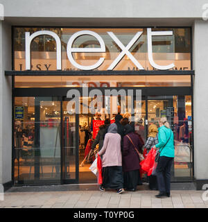 Queues of shoppers in Preston, Lancashire, UK. 23rd March, 2019. Next mid-season spring sale. The Next sale is a retail legend, with hundreds of shoppers up and down the country flocking to stores, and on-line to grab some clearance bargains. Stock Photo