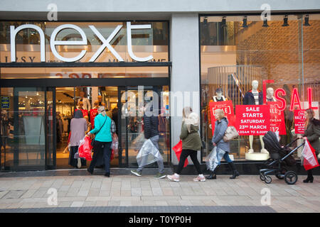 Queues of shoppers in Preston, Lancashire, UK. 23rd March, 2019. Next mid-season spring sale. The Next sale is a retail legend, with hundreds of shoppers up and down the country flocking to stores, and on-line to grab some clearance bargains. Stock Photo