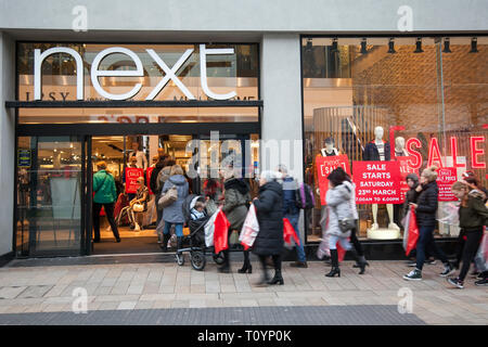 Queues of shoppers in Preston, Lancashire, UK. 23rd March, 2019. Next mid-season spring sale. The Next sale is a retail legend, with hundreds of shoppers up and down the country flocking to stores, and on-line to grab some clearance bargains. Stock Photo