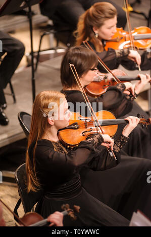 Tyumen, Russia - January 25, 2017: Concert of orchestra of the Tyumen philharmonic hall for photographers. The violin group plays Stock Photo