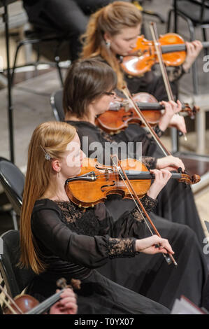 Tyumen, Russia - January 25, 2017: Concert of orchestra of the Tyumen philharmonic hall for photographers. The violin group plays Stock Photo