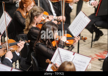 Tyumen, Russia - January 25, 2017: Concert of orchestra of the Tyumen philharmonic hall for photographers. The violin group plays Stock Photo