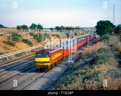 A class 90 electric locomotive number 90031 working a Royal Mail postal train at Castlethorpe on the 16th September 2003. Stock Photo