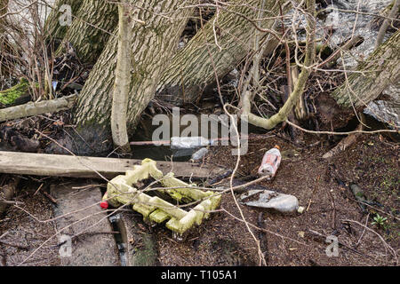 UK. Plastic waste floating in the River Lugg, in a remote rural area in mid-Wales Stock Photo