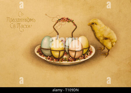 Antique Easter card with the inscription "Happy Easter!" and decorated Easter eggs and chicken Stock Photo