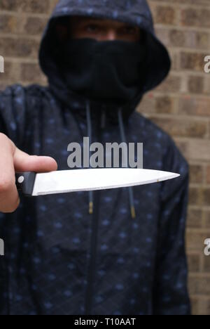 teenagers carrying knives Stock Photo