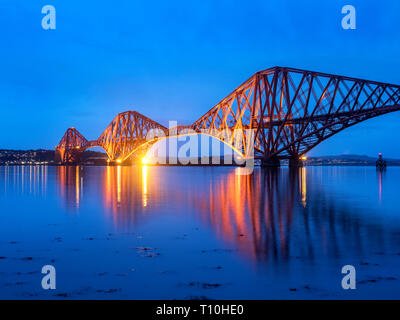 The Forth Bridge railway bridge over the Firth of Forth at dusk from South Queensferry City of Edinburgh Scotland Stock Photo