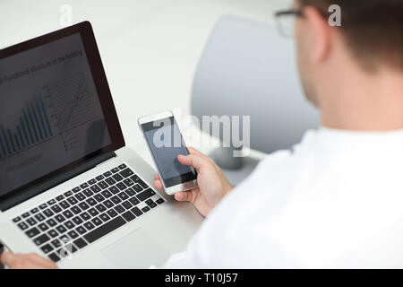 close up. businessman using gadgets to check financial data Stock Photo