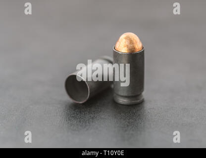 Two bullets on dark background. Stock Photo