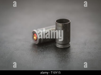 Two bullets on dark background. Stock Photo