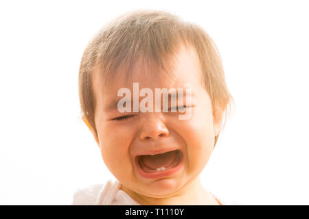 Close up of a 1 year old baby girl crying Stock Photo