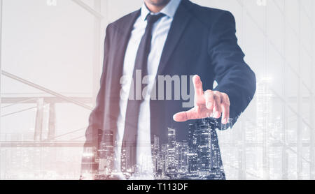 Businessman hand touching empty virtual screen, modern business background concept Stock Photo