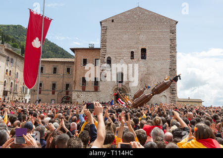 GUBBIO, ITALY - MAY 15 2016 - The Ceri are lifted as the race starts and the crowds look on to celebrate the annual Festa dei Ceri. Stock Photo