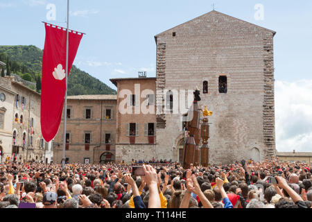 GUBBIO, ITALY - MAY 15 2016 - The Ceri are lifted as the race starts and the crowds look on to celebrate the annual Festa dei Ceri. Stock Photo