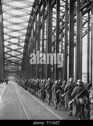 Nazism / National Socialism, politics, entry into demilitarized Rhineland, infantrymen are marching across the Deutzer Bridge, Cologne, 7.3.1936, Additional-Rights-Clearance-Info-Not-Available Stock Photo