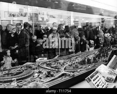 Christmas, shopping / presents, people in front of shop window with toy train, Hamburg, 17.10.1970, Additional-Rights-Clearance-Info-Not-Available Stock Photo