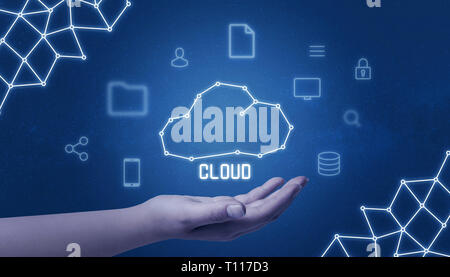 Cloud computing concept with cloud drawing in hand surrounded with tehnology icons. Stock Photo