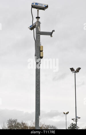 Some posts with surveillance cameras Stock Photo - Alamy