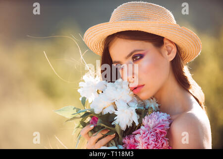 Spring allergy. face and skincare. Travel in summer. Woman with fashion makeup. flowers. Spring woman. Springtime and vacation. Summer girl with long