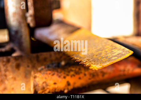 Old rusty saw isolated on rusty industrial equipment Stock Photo