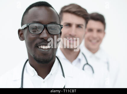 group of multi-racial doctors standing in a row Stock Photo