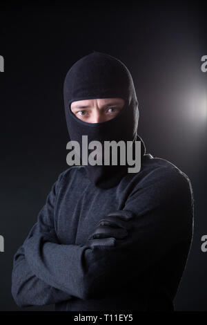 Robber man in bachelor with arms crossed. Stock Photo