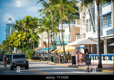 MIAMI - SEPTEMBER, 2018: Workers prepare for breakfast crowds at the sidewalk cafes lining Ocean Drive in South Beach. Stock Photo