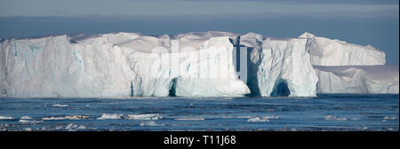 Antarctica, below the Antarctic Circle. Ice filled bay in the Bellingshausen Sea in Crystal Sound. Tabular iceberg. Stock Photo