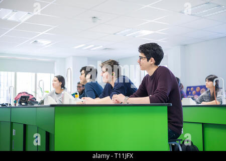 A classroom full of international students during a science lesson Stock Photo
