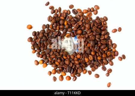 Coffee beans and one hundred dollar bill. Roasted coffee beans background. Financial concept. Isolated on white Stock Photo