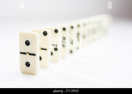 domino tiles in a row on a white background Stock Photo