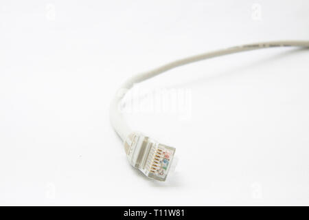 a short gray patchcable in front of a white background Stock Photo