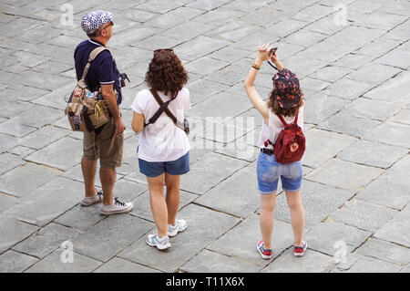 Verona, Italy - September 5, 2018: tourist taking a photo of the famous Verona Arena, a Roman amphitheatre in Piazza Bra in Verona, built in the first Stock Photo