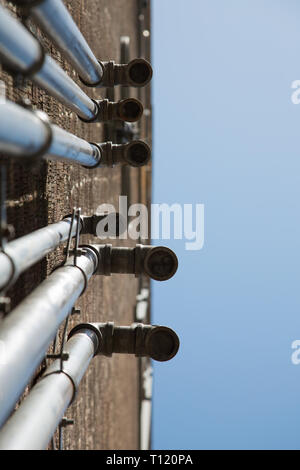 Ventilation industrial meta pipes wall blue sky copy space  Stock Photo