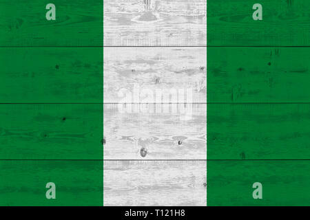 Nigeria flag painted on old wood plank. Patriotic background. National flag of Nigeria Stock Photo