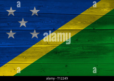 Solomon Islands flag painted on old wood plank. Patriotic background. National flag of Solomon Islands Stock Photo