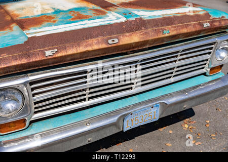 Front of old rusty turquoise Ford pickup truck with California license plate Stock Photo