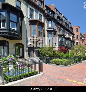 Victorian facades in Back Bay, Boston. Red brick sidewalk, wooden bay windows, classic, elaborated, elegant Stock Photo