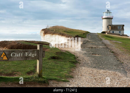 The erosion of the chalk cliffs once again threatens the Belle Tout lighthouse near Beachy Head on the Sussex coast. Stock Photo