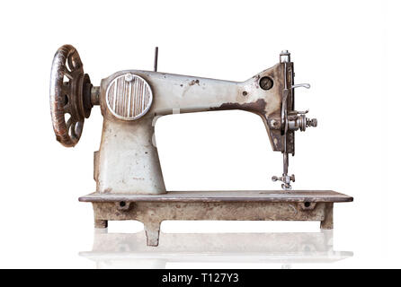 old sewing machine isolated on white background with clipping path. Stock Photo
