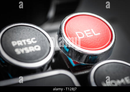 An extreme close-up or a macro shot of black circular metal keyboard keycap from a retro typewriter with shallow depth of field and selective focus. Stock Photo