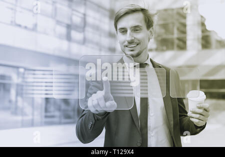 Man in business suit pressing icons on virtual digital touchscreen Stock Photo