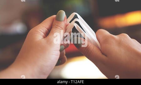 Hands break plastic dishes, people ban and stop using plastics garbage. Concept of Recycling plastic and ecology - blurred background Stock Photo