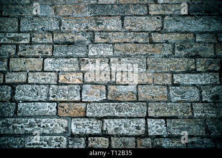Abstract background of old cobblestone pavement. Grey stone brick paving texture. Close up of ancient road. Walking in an old city. Old bricks texture Stock Photo