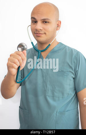 Bald doctor with medical scrubs Stock Photo