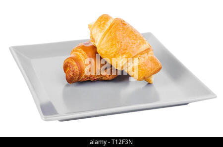 two croissants on a square grey plate isolated on white Stock Photo